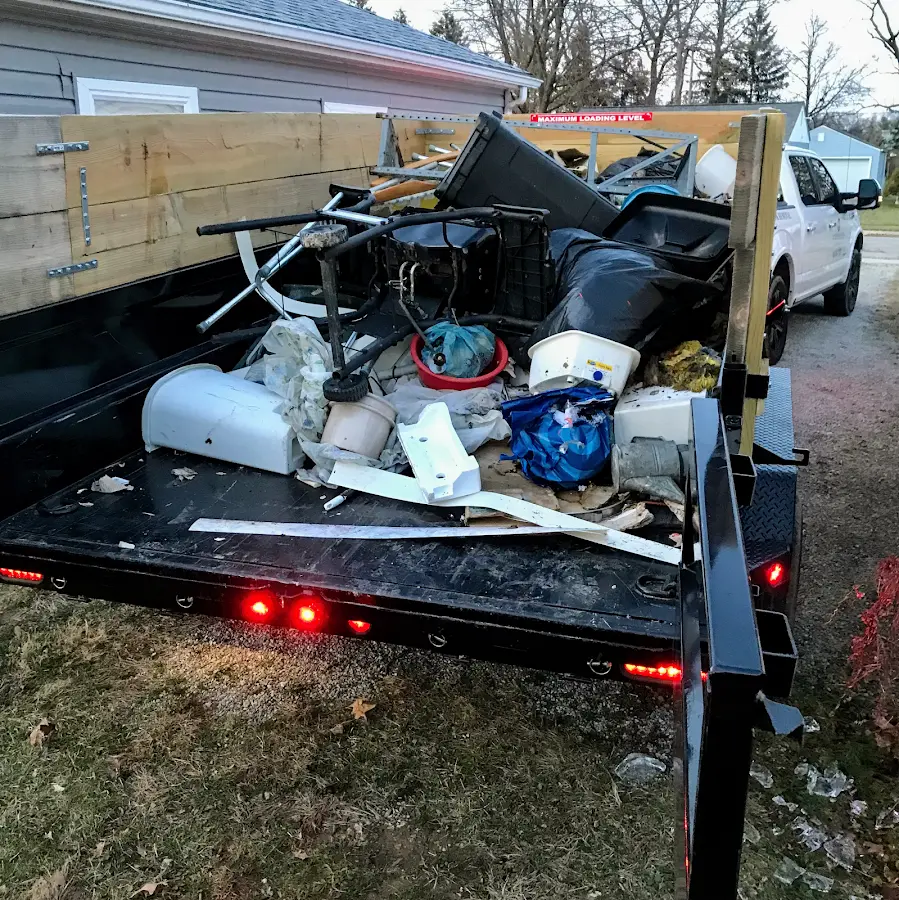 Roll-off dumpster delivered to a residential driveway in Lemay